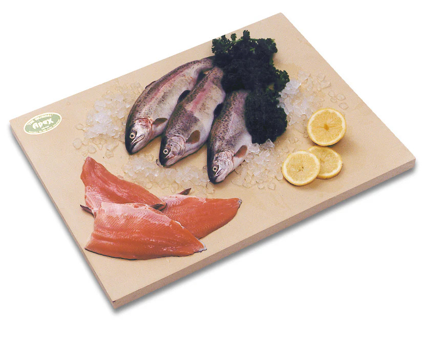 Wooden chopping board with assorted fish