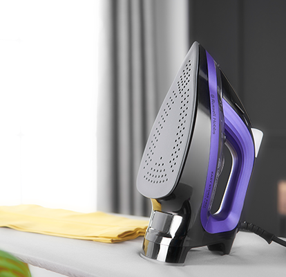 steam iron on ironing board